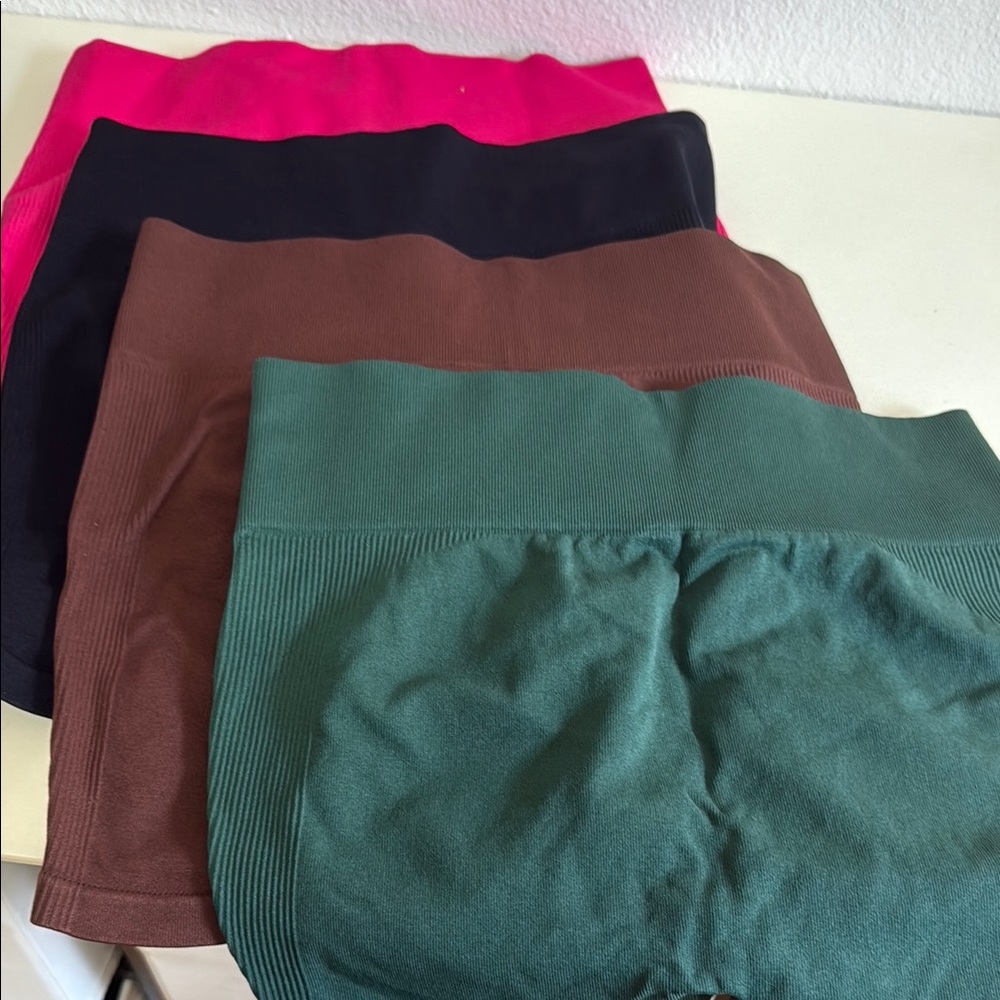 - Set of Four Seamless Shorts in Pink, Black, Brown, and Green